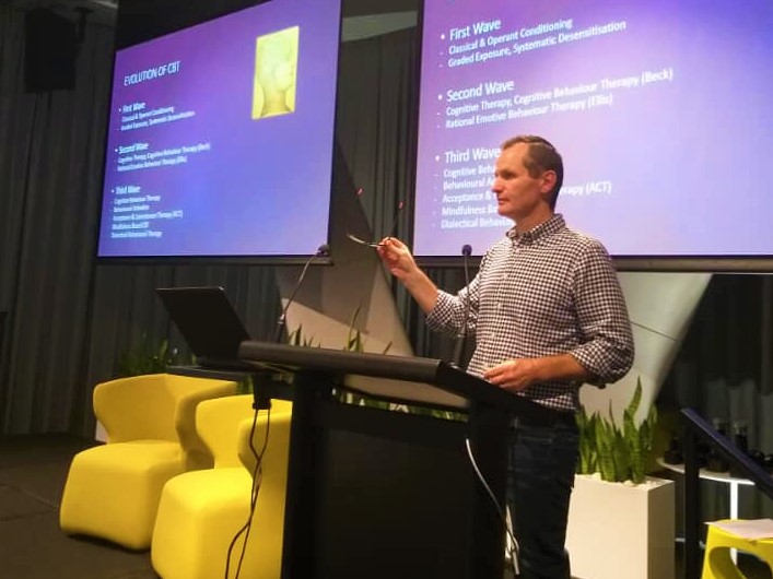 Our director speaking at a conference